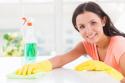 Carpet cleaning technician preparing equipment with safety in mind