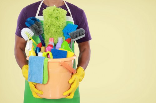 Staff member wearing PPE during a carpet cleaning task