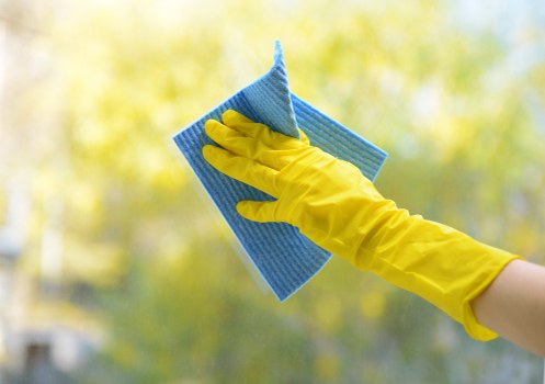Cleaner maintaining a shared apartment entrance in Lambeth
