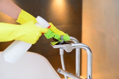 Cleaner working in a Lambeth apartment during a regular cleaning visit